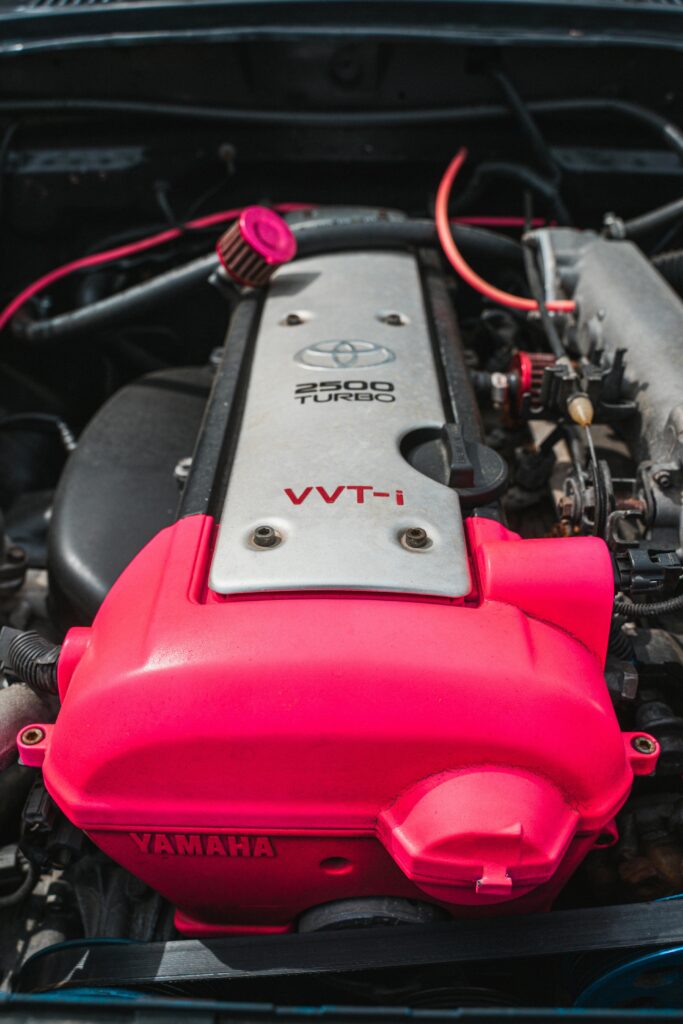 Detailed view of a Toyota VVT-i turbocharged engine with vibrant components.
