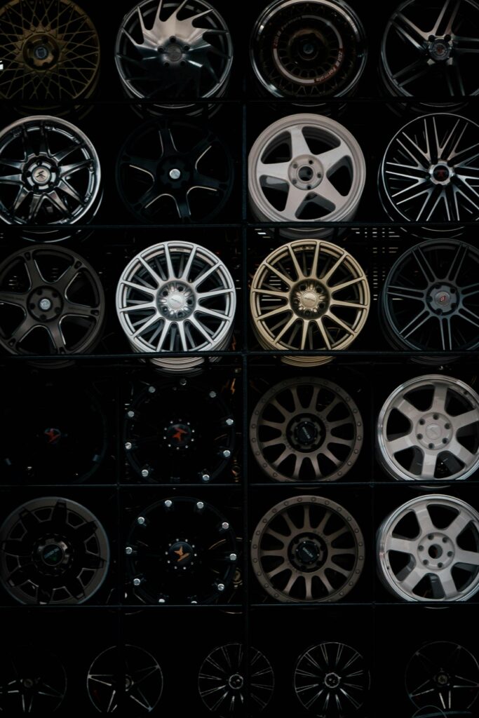 A variety of alloy wheels on display, showcasing different styles and finishes.