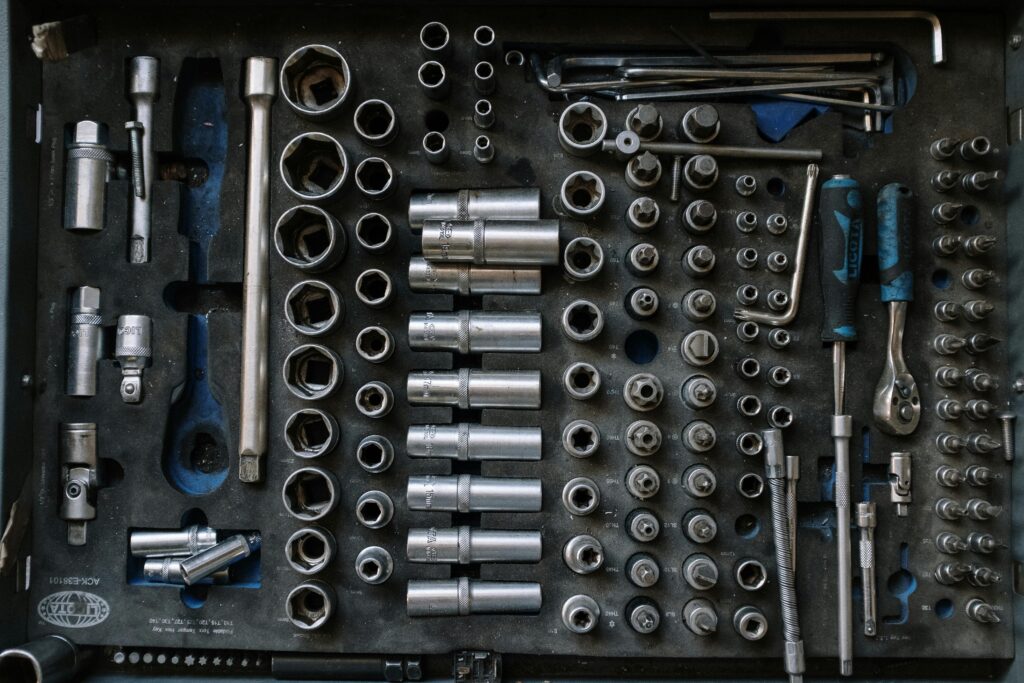 Flat lay of a complete toolset neatly organized in a workshop setting, essential for auto repair tasks.